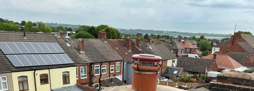 This is a photo taken from a roof which is being repaired by LJ Roofing Malmesbury, it shows a street of houses, and their roofs